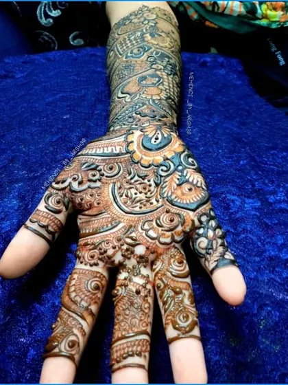 A close-up of a single hand, highlighting the intricate patterns on the palm and fingers.