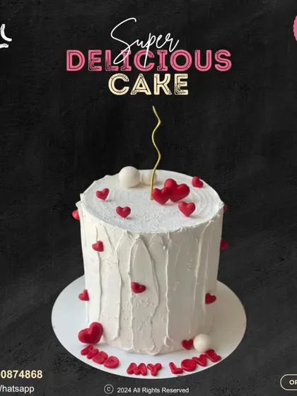 "HBD My Love." A simple yet romantic cake, this design features rustic white frosting dotted with small red hearts, conveying a sweet and heartfelt message.