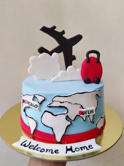 Welcome home! This cake was designed for someone flying back to Delhi from Chicago. The world map and travel-themed fondant toppers made it a very special homecoming treat.