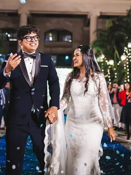 A joyful exit as the happy couple is showered with petals. Her makeup is designed to be long-lasting and picture-perfect throughout the entire celebration.