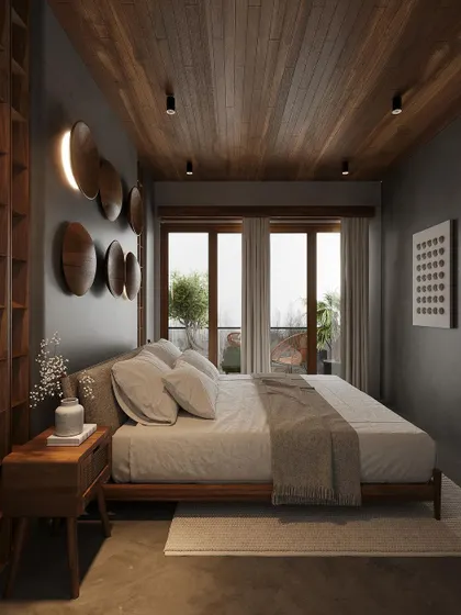 Another view of the bedroom, showing the interplay of light and shadow from the balcony doors.