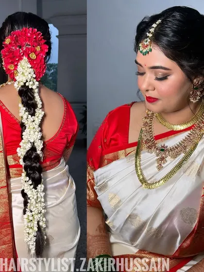 I craft authentic South Indian bridal hairstyles, like this traditional braid. The look is completed with a full arrangement of fresh jasmine and red flowers, creating a classic and culturally rich bridal statement.