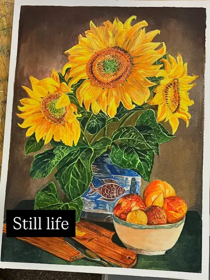 This beautiful still life of sunflowers in a vase is an example of an advanced acrylic project. The student has masterfully captured the texture of the petals and the reflection on the vase.