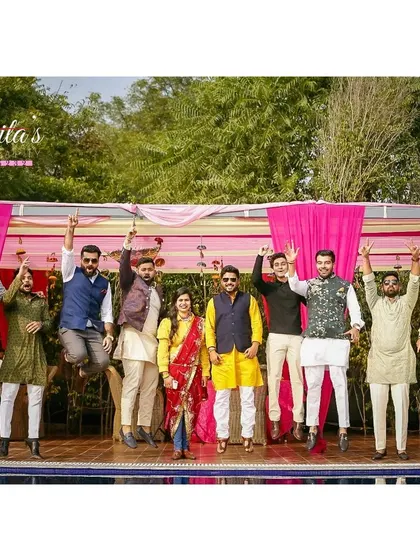 A jump for joy. The groom's entire party, including the bride, jumping in celebration makes for a dynamic and energetic group portrait.
