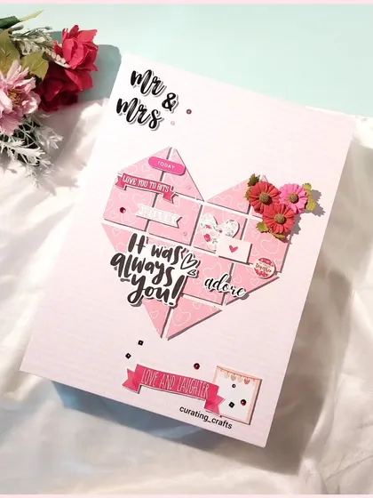 A heart-shaped mosaic of memories on the cover of this A4 scrapbook, with the message "It was always you!"