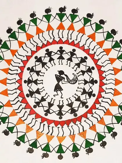 A classic Warli painting depicting the tarpa dance. In our workshops, you will learn the symbolic language of this tribal art form, using simple geometric shapes to tell stories.