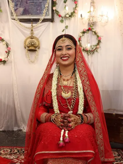 A duplicate of a previous image, a seated portrait of the bride during her ceremony.
