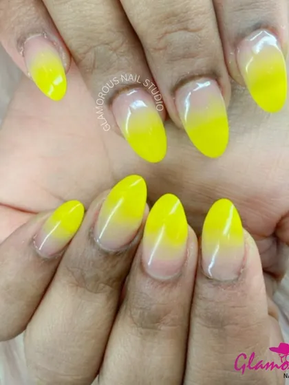 Bring a little sunshine to your fingertips with this cheerful yellow ombré. The color fades beautifully from a vibrant yellow at the tip to a soft, natural nude at the base, creating a fresh and happy vibe.