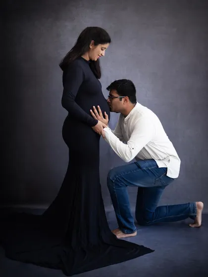 A tender kiss for the baby bump is a must-have shot in any maternity session. It’s a beautiful way for the dad-to-be to connect with the baby.