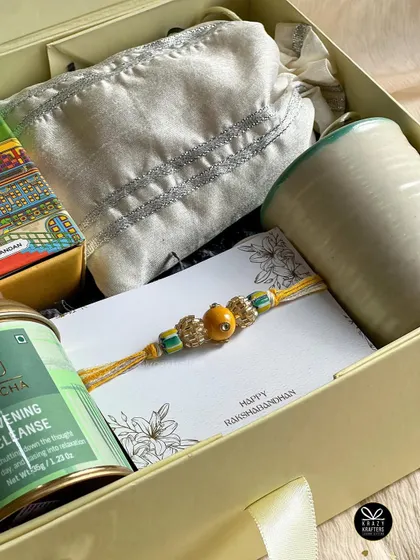 A close-up of the 'Good Vibes Only' hamper, showing the calming green and yellow color palette.
