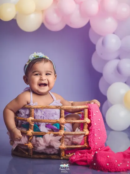 That laugh is infectious. We love capturing these moments of pure happiness in our colorful and fun studio setups.