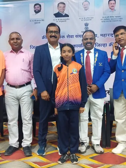 Standing with my student Muskaan Gupta and officials at the School Games State Championship. She fought hard and won a silver medal, making us all very proud.