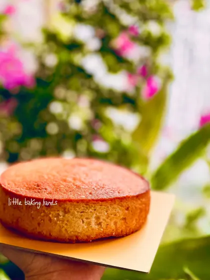 My French vanilla pound cake, held up against a beautiful floral background. It's a simple cake, but its flavour is anything but plain.