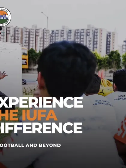 Experience the IUFA difference. A coach uses a whiteboard on the field to explain tactics and strategy to our young players.