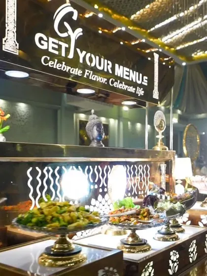 An overview of one of our elegant buffet counters. The combination of black, gold, and intricate patterns creates a luxurious and modern look for any celebration.