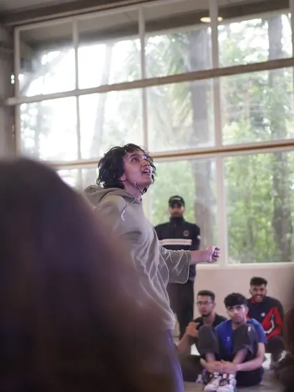 A dancer feeling the music during the 1 vs 1 Hip-Hop battle at Spectra.