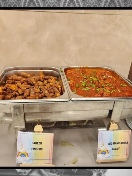 A New Year's spread featuring some of our popular vegetarian main courses: crispy Paneer Fingers and a flavorful Veg Manchurian Gravy.