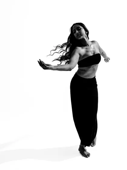 A soft, flowing pose from a black and white movement series.