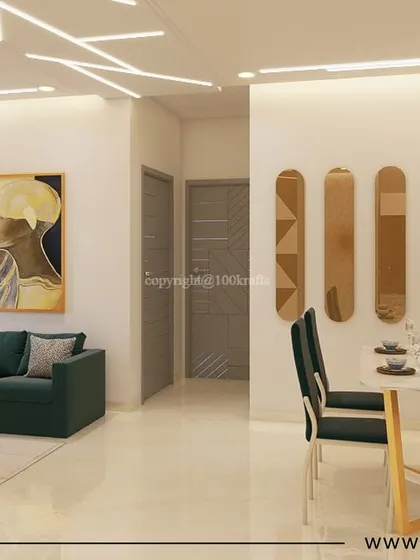 The open-plan living and dining area in our 'Konark Oasis' project. A deep green sofa adds a pop of color, while the artistic wall decor and unique mirror arrangement create a stylish, gallery-like feel.