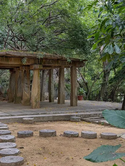The ancient Stone Mantapa, nestled in a quieter part of the garden, feels like a discovery. Its weathered stone pillars tell a story of centuries past.