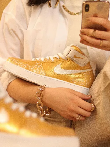 Holding the golden, Indian-inspired custom AF1 mids. This project was all about capturing the opulence and detailed craftsmanship of high-end Indian fashion on a pair of sneakers.