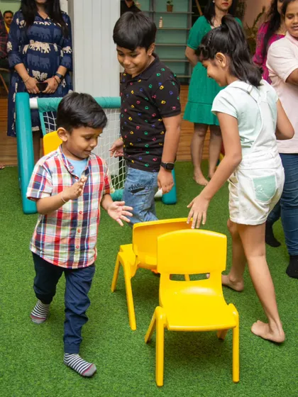 What are birthdays without a few games? The kids are in motion, running around the chairs and getting ready for the music to stop.