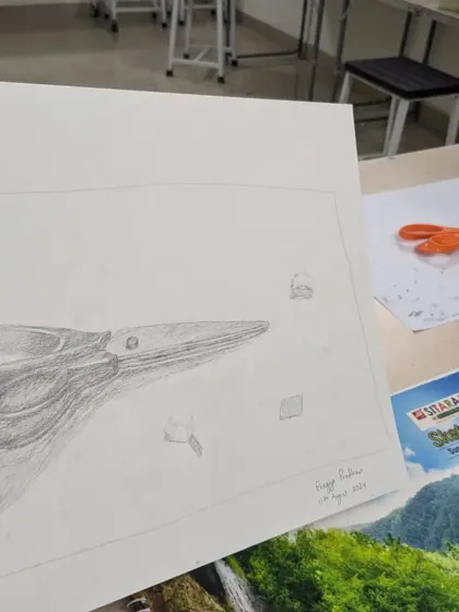 A work-in-progress pencil sketch of scissors. This shows the initial stages of blocking out shapes and building up tones to create a three-dimensional form.