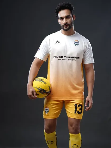 Sam in our academy's away kit. His journey is a perfect example of how our program helps you unlock your potential both on and off the pitch.