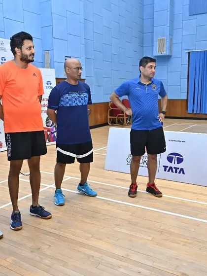 Our coaches briefing a group of adult players before a match at our intra-academy tournament, highlighting the active adult community at our centers.