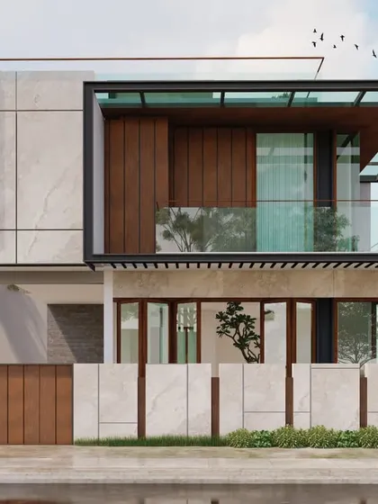 A street-level view of the same project, emphasizing the strong geometric forms and the contrast between the solid stone-clad volume and the transparent glass sections.