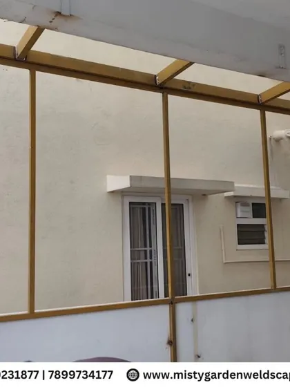 The metal framework for a narrow passage, designed to be covered for all-weather use.