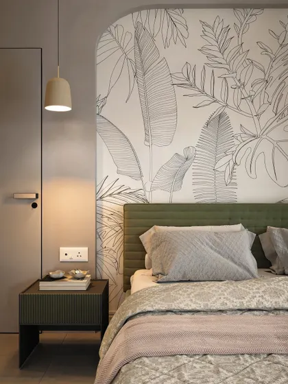 A close-up of the bedside, highlighting the custom headboard mural, minimalist pendant light, and the texture of the wall finish.