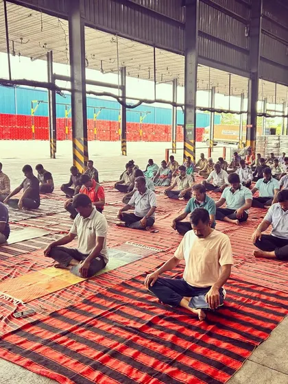 A moment of quiet meditation during the corporate yoga session. Even in a busy warehouse, we were able to find a sense of collective calm and focus.