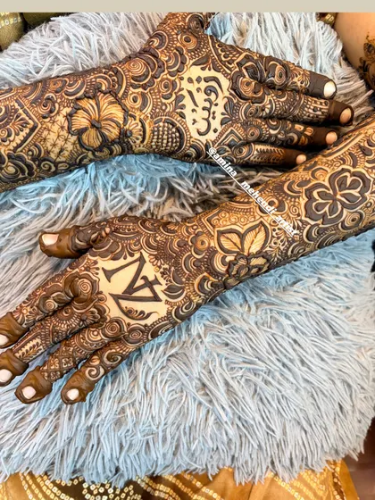 A beautiful shot of the 'N' and 'Z' initials, surrounded by intricate floral and paisley details.