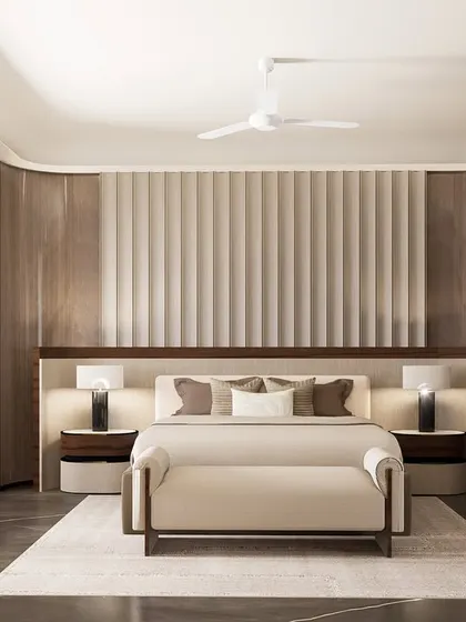 In this contemporary master bedroom for a Gurugram residence, we layered textures and materials to create depth. The space features veneer cladding, stitched leather panels, and custom lighting, all converging to form a sophisticated personal retreat.