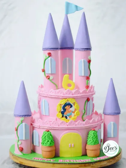 This dreamy pink and purple castle cake was made for a little princess's 6th birthday. I love adding details like the climbing roses and the flag on top to make it feel truly magical.