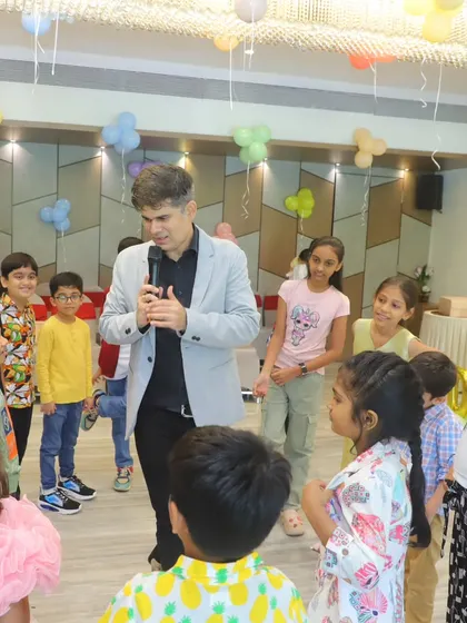Interacting with the kids on the floor, making sure everyone feels included in the fun and games.