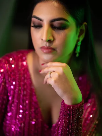 What's not to love about this look? The client is party-ready in a sequined pink dress, with makeup that is sultry and glamorous.