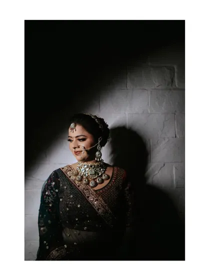 Another artistic portrait of Payal, using strong shadows to create a moody and high-contrast image.