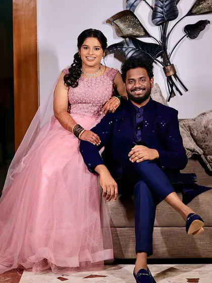 A posed shot of the couple. The bride's makeup is flawless, with a focus on radiant skin and defined eyes that complement her princess-style gown.