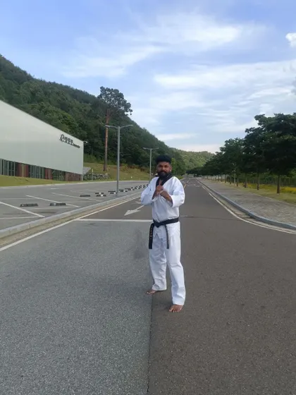 Finding a moment for a quick pose on the roads of Muju.