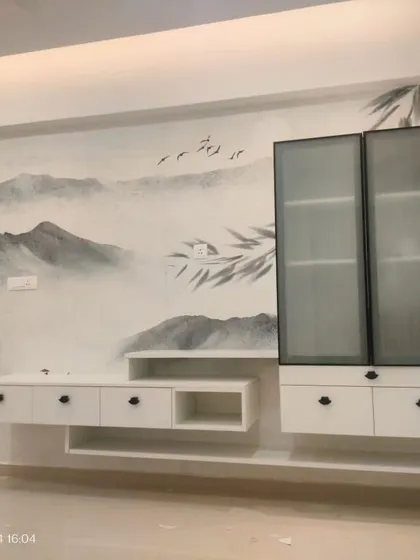 A minimalist, ink-wash style mural of mountains and bamboo, creating a serene, Zen-like atmosphere around this media unit.