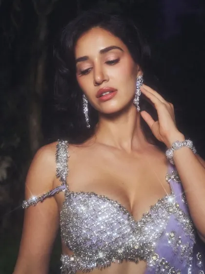 A close-up that captures the intricate details of the blouse and jewelry. I kept the makeup elegant and understated to let the outfit's sparkle take center stage.