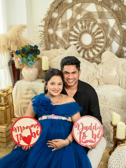 This happy couple is ready to be parents. These shots show their joy using fun props in our cozy boho-themed studio corner.