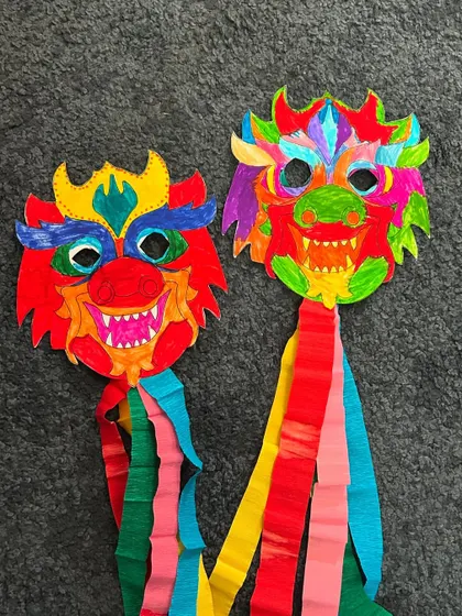 I love the rainbow colours on these dragon masks. So much energy and creativity!