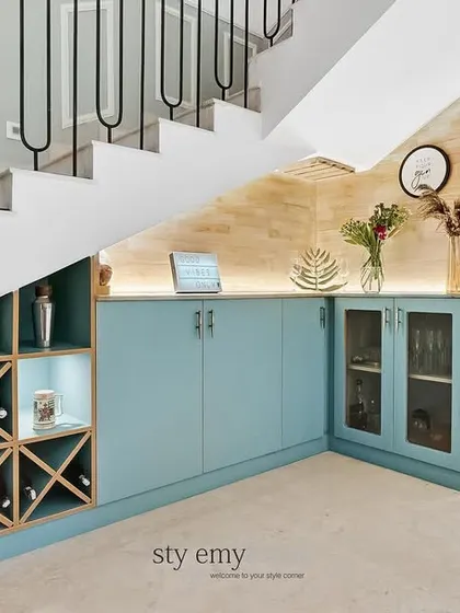 We didn't have a lot of height under the stairs, so we designed this wide bar unit with a built-in wine rack to make the most of the space.