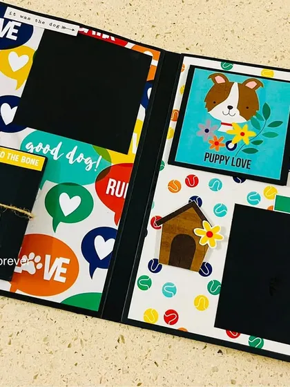 This page layout from our dog scrapbook is perfect for showcasing multiple photos. It includes fun embellishments like a fire hydrant and a dog house, adding to the playful theme.
