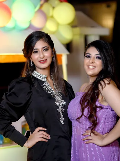 A bright and happy portrait of two friends at a celebration. My goal is to provide guests with professional-quality photos they'll be excited to share.