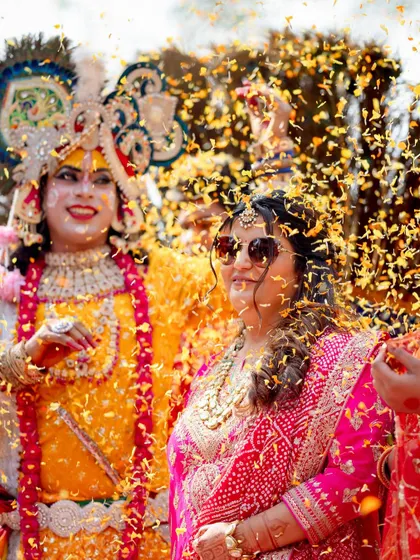 A shower of flowers for the bride, surrounded by her loved ones. These are the moments of collective celebration we live for.