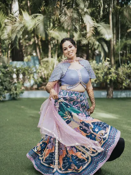 A twirling shot that captures the fun spirit of a Mehendi ceremony. The makeup is designed to be light and comfortable for a day of festivities.